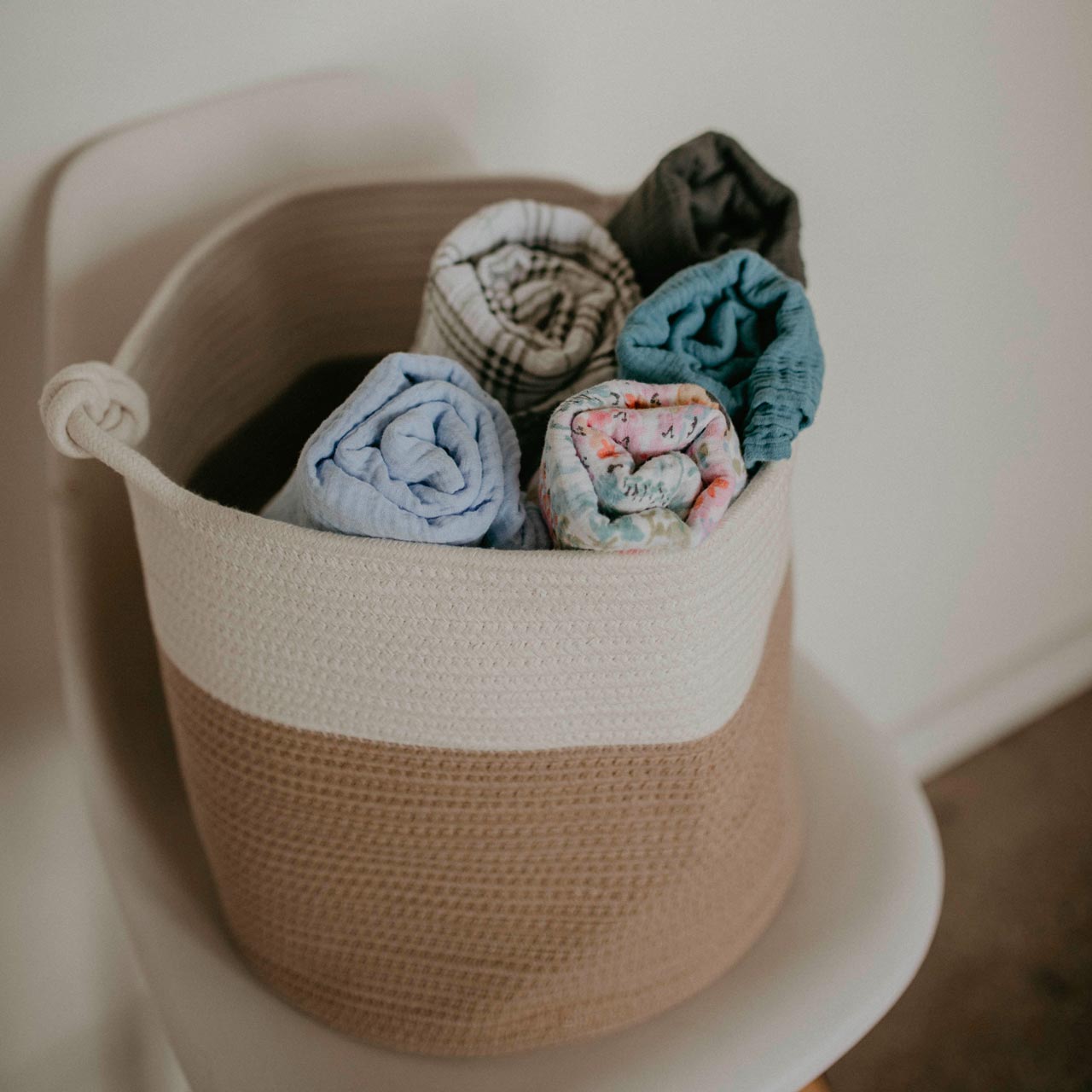 Rolled up Swaddles in Basket.