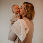 White burp cloth for mom's shoulder.