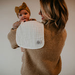 White burp cloth for mom's shoulder.