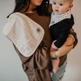 White burp cloth for mom's shoulder.