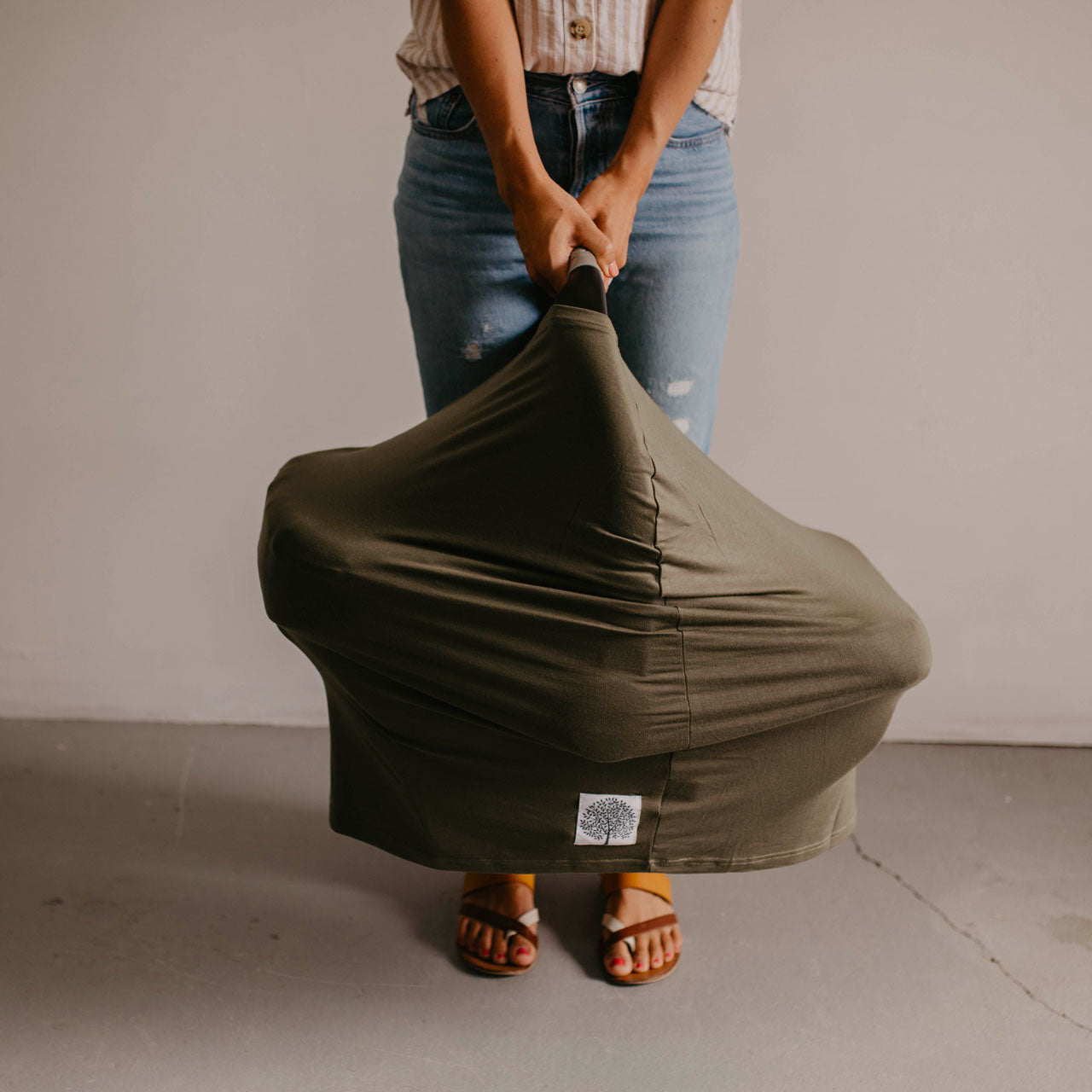 Pine Multi use cover on a car seat