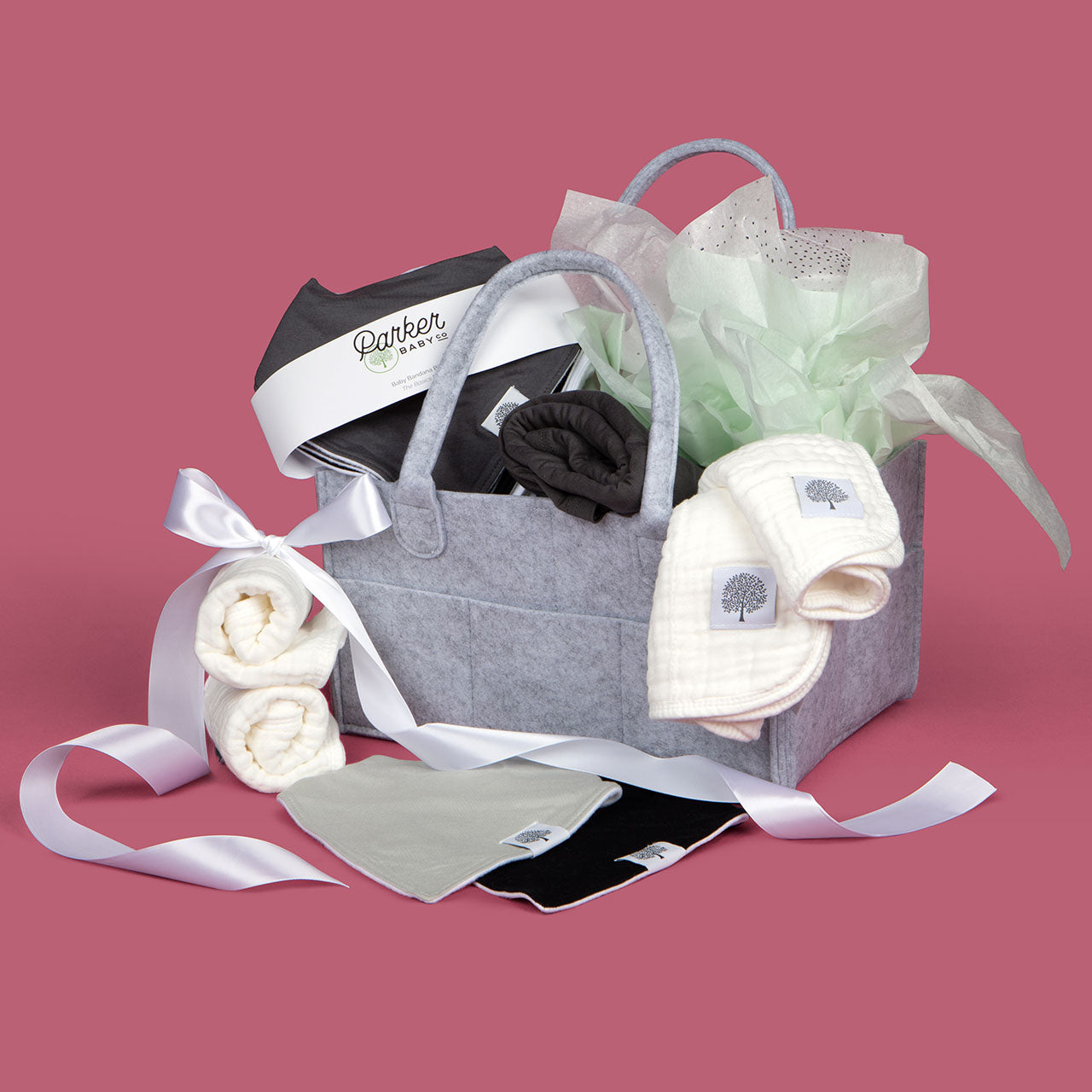 Basics gift set includes muslin cotton burp cloths, gray diapper caddy, gray car seat cover and set of 8 bandana bibs for baby