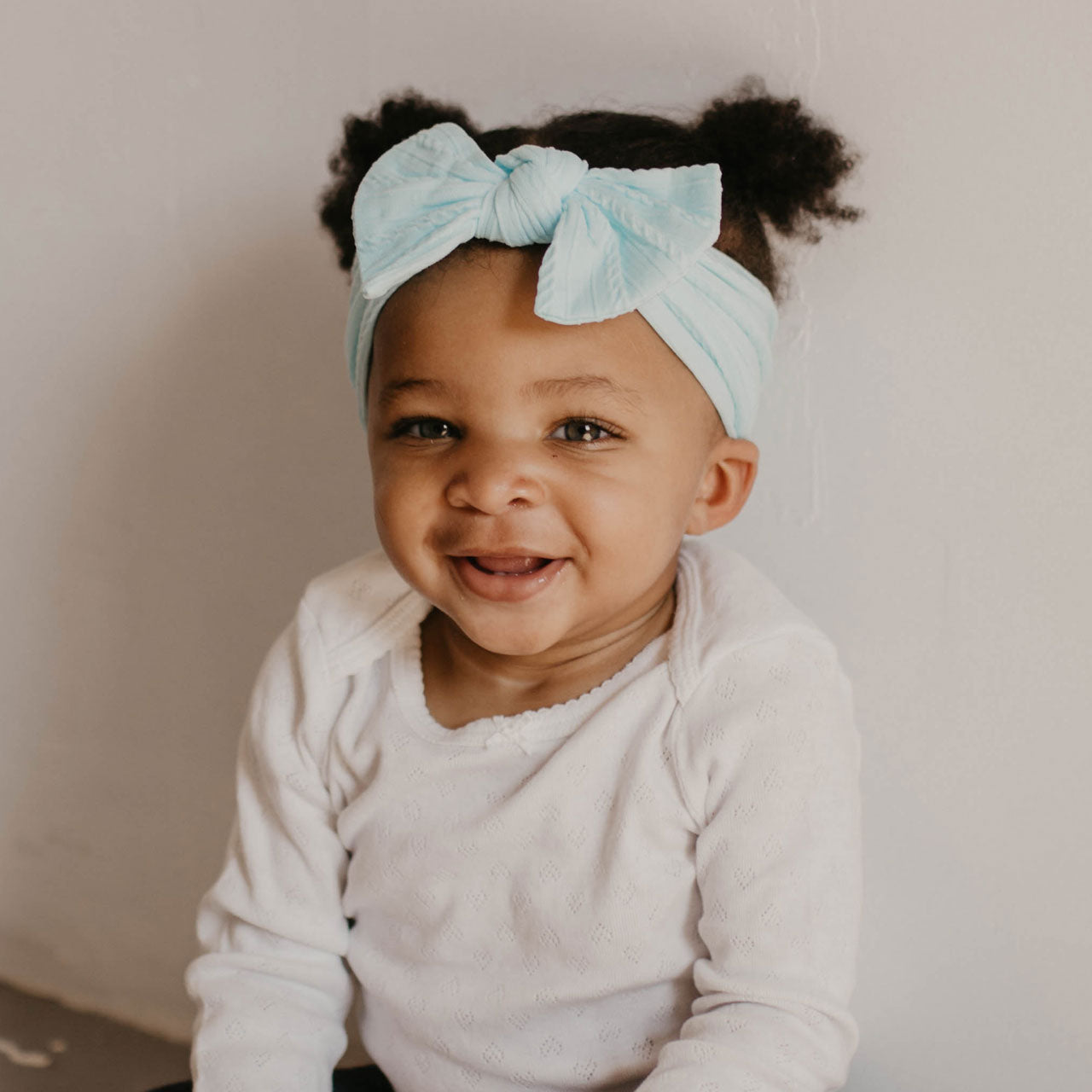 Light Blue Cable Knit Knotted Headband. 