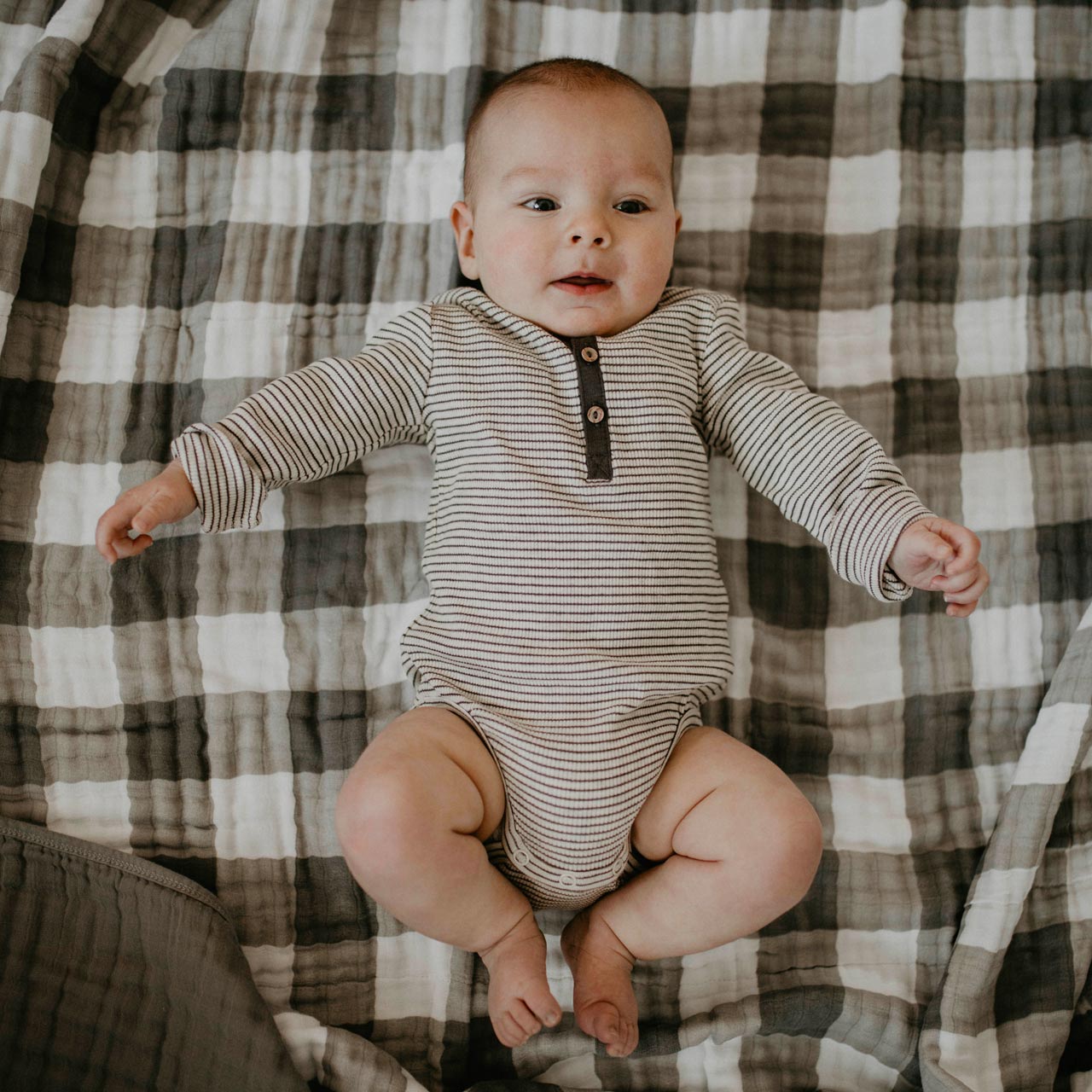 The Gray Buffalo Muslin Quilt for baby to lay on. 