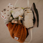 Burp Cloths in Diaper Caddy. 