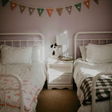 Dreamy Floral Quilt on toddler bed. 