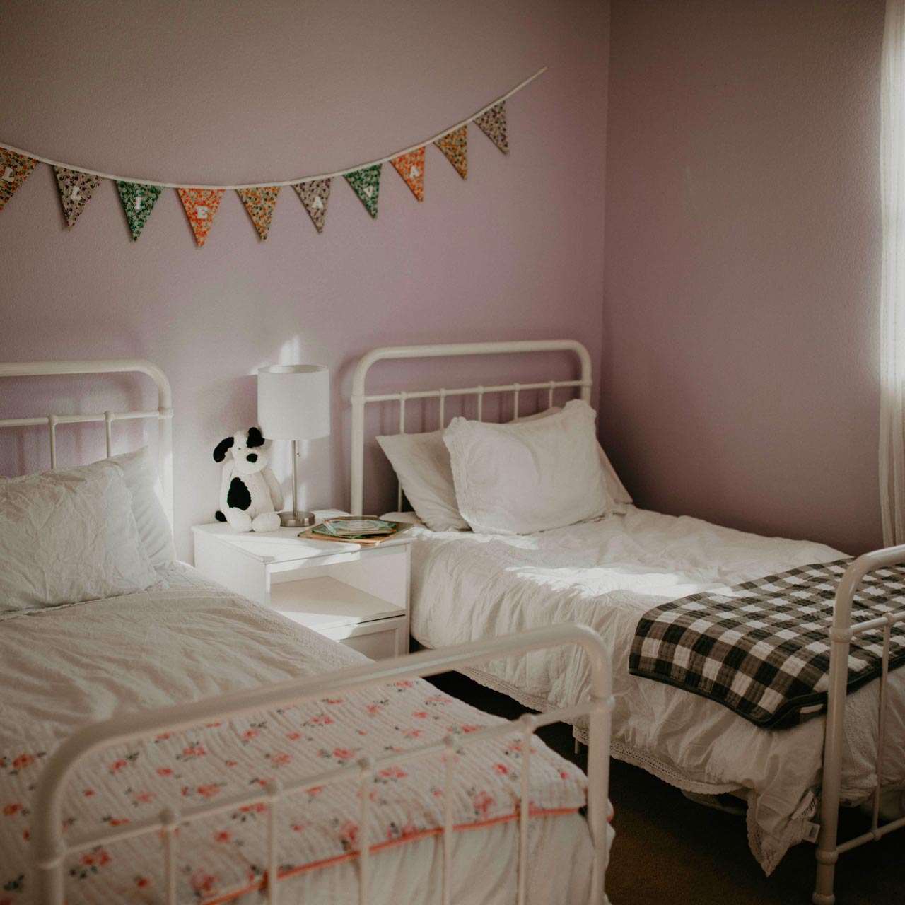 Dreamy Floral Quilt on toddler bed. 