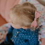 Pink sparkle bow clip for toddler. 