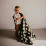 Green buffalo quilt for toddler.