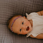 Purple braided headband for girl.