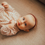 Maroon braided headband for baby girl.