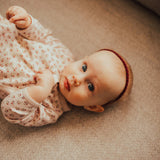 Maroon braided headband for baby girl.