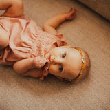 Mustard braided headband for baby girl.