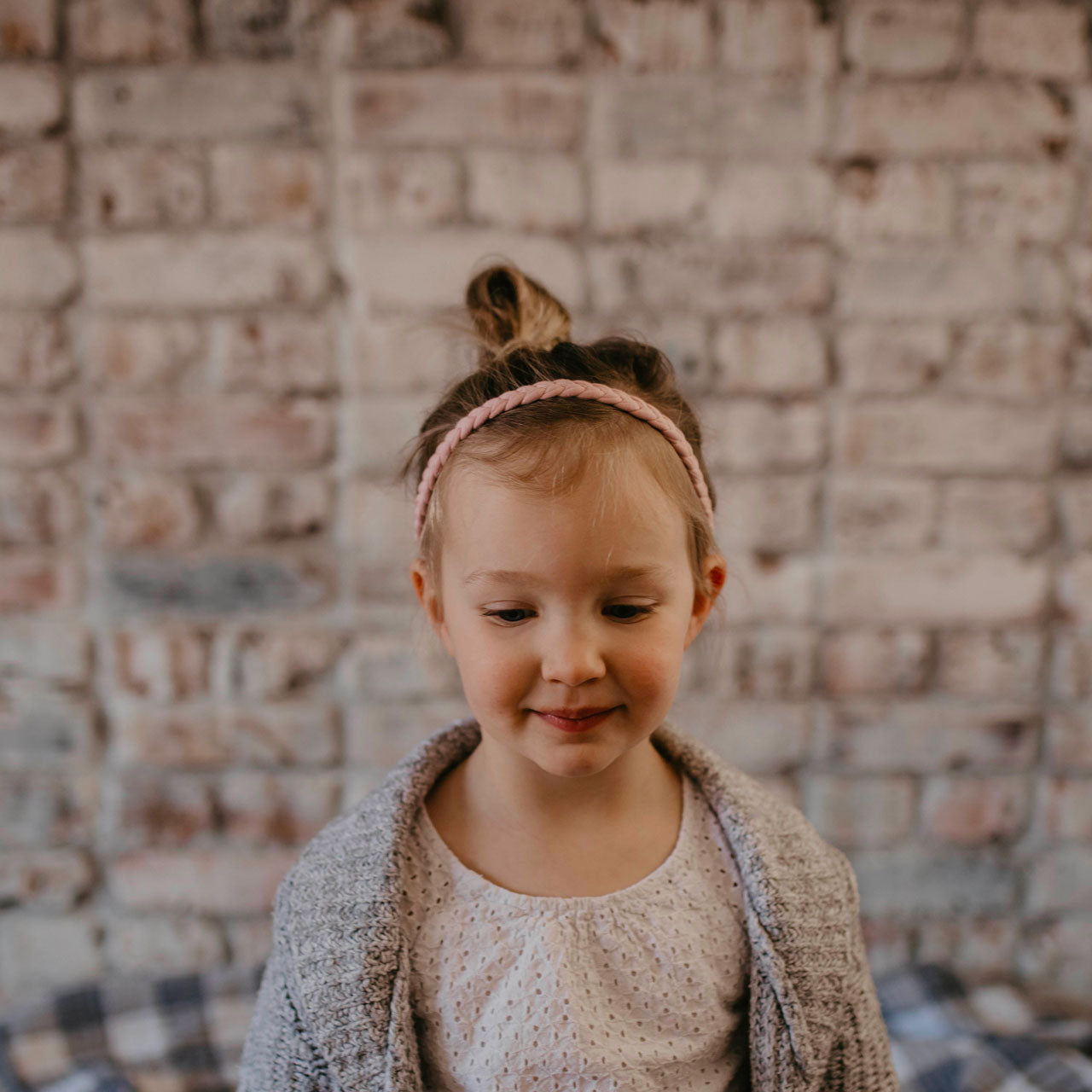 Pink braided headband for girl.