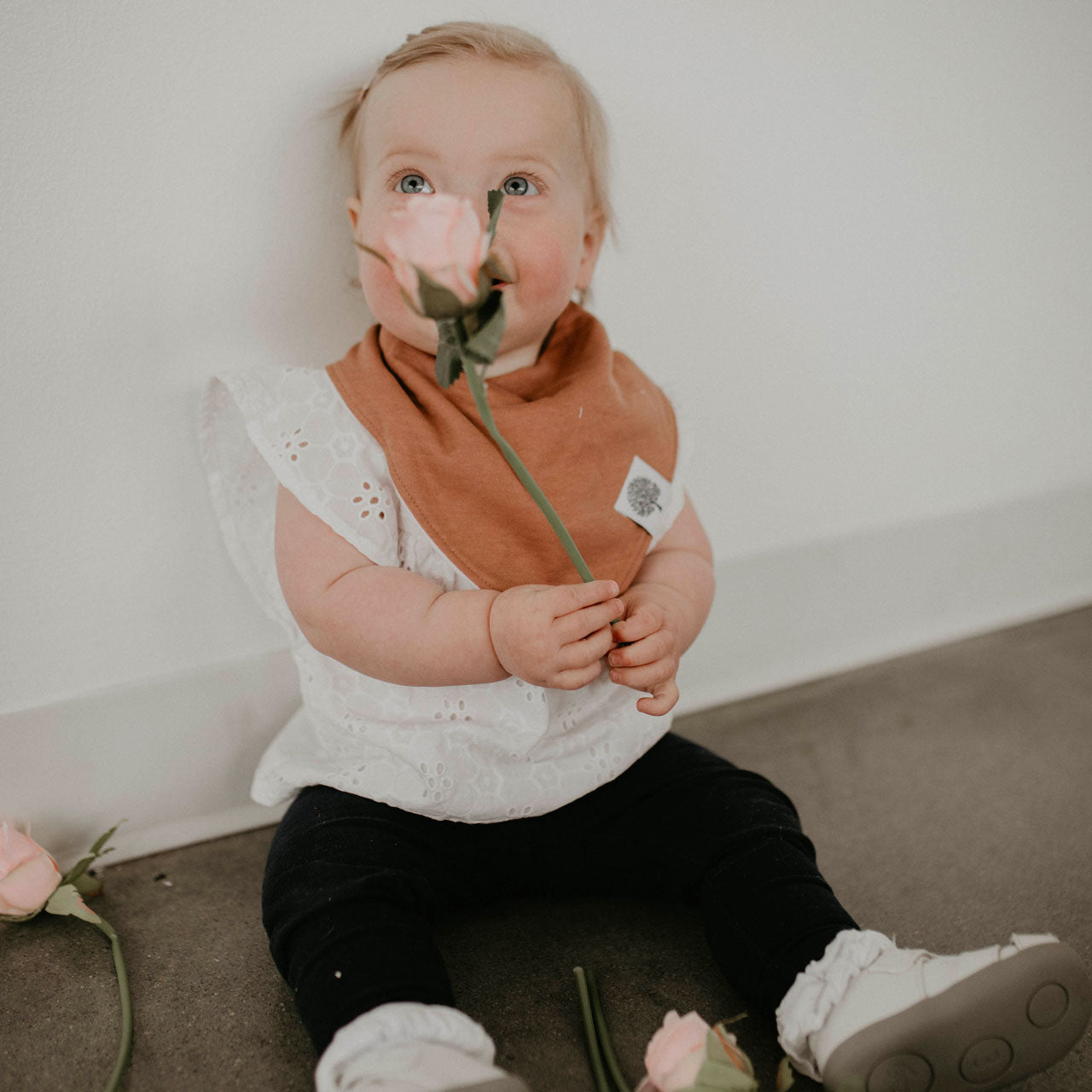 Copper bandana bib on baby girl