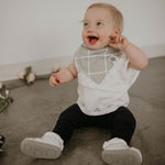 Gray grid bandana bib on baby girl