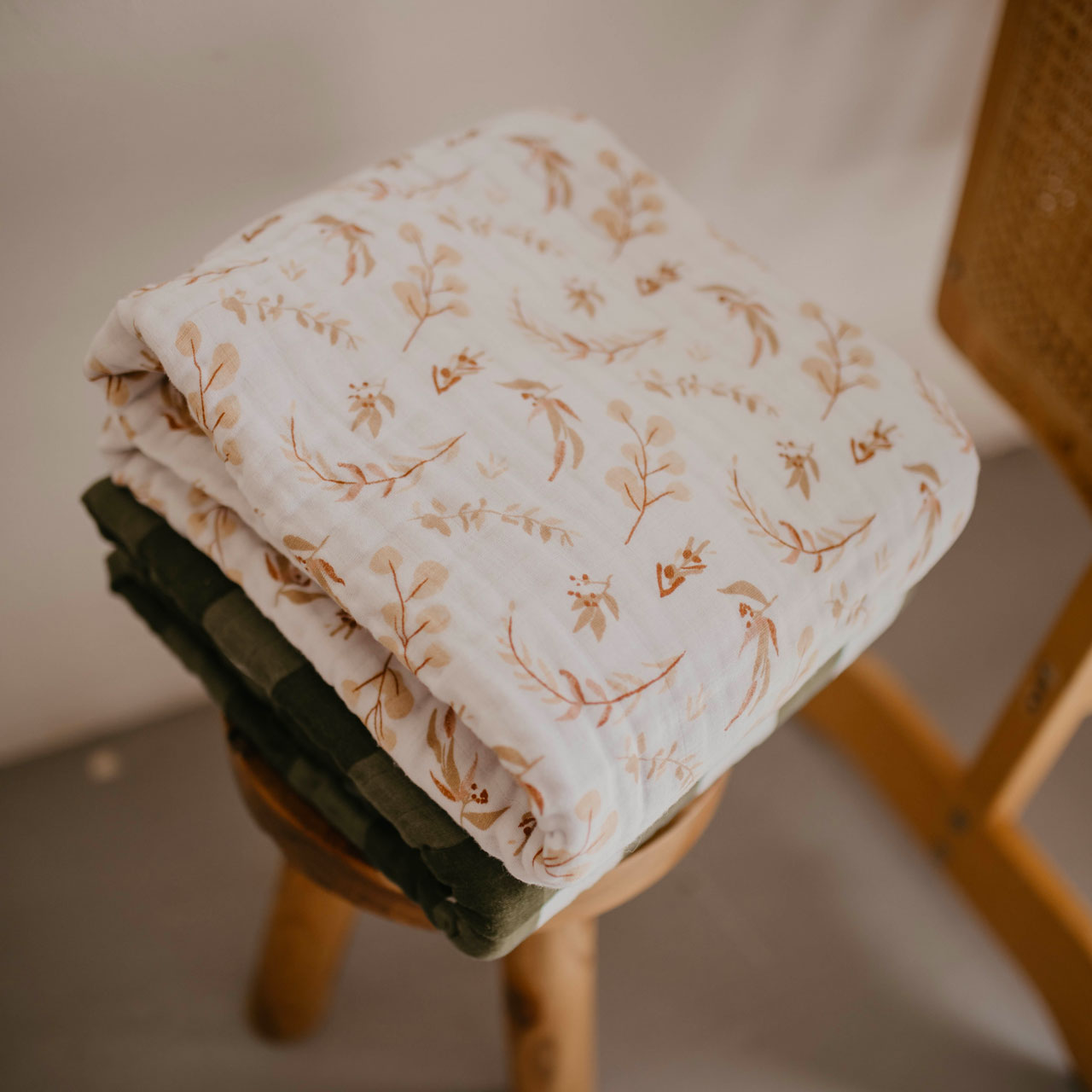 Prairie floral quilt stacked on stool