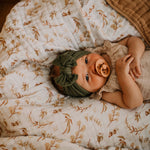 Prairie floral quilt under baby