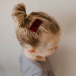 Red velvet hair clip for girl.