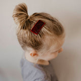 Red velvet hair clip for girl.