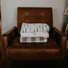 Stack of muslin quilts.
